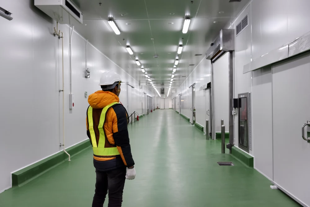 =staff-worker-standing-control-inside-cold-storage-ante room chiller